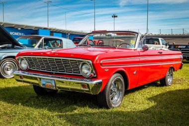 Daytona Beach, FL - November 24, 2018: Low perspective front corner view of a 1964 Ford Falcon Futura Convertible at a local car show.