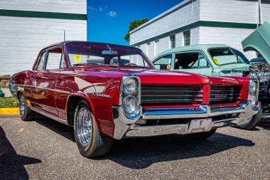 Falcon Heights, MN - June 17, 2022: Low perspective front corner view of a 1964 Pontiac Catalina 2 Door Hardtop Coupe at a local car show.