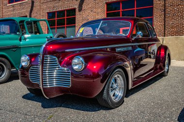 Falcon Heights, MN - June 17, 2022: Low perspective front corner view of a 1940 Buick Super Coupe at a local car show.