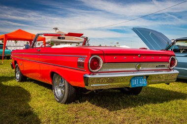 Daytona Beach, FL - November 24, 2018: Low perspective rear corner view of a 1964 Ford Falcon Futura Convertible at a local car show.