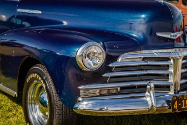 Daytona Beach, FL - November 24, 2018: Front corner close up detail view of a 1948 Chevrolet Series 2100 FK Fleetmaster Coupe at a local car show.