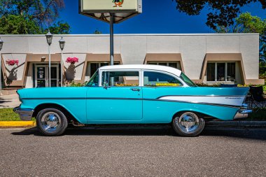 Falcon Heights, MN - June 17, 2022: Low perspective side view of a 1957 Chevrolet 210 2 Door Sedan at a local car show.