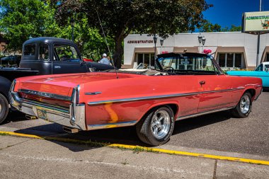 Falcon Heights, MN - June 17, 2022: Low perspective rear corner view of a 1964 Pontiac Catalina Convertible at a local car show.