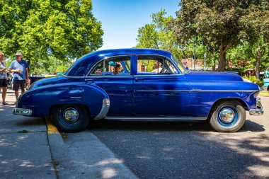 Falcon Heights, MN - June 17, 2022: Low perspective side view of a 1950 Chevrolet Styleline Deluxe Sedan at a local car show.