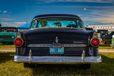 Daytona Beach, FL - November 24, 2018: Low perspective rear view of a 1955 Ford Fairlane Victoria Hardtop Coupe at a local car show.