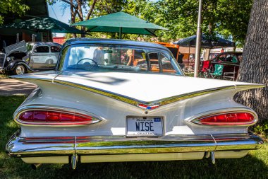 Falcon Heights, MN - June 17, 2022: Hhigh perspective rear view of a 1959 Chevrolet Biscayne 2 Door Sedan at a local car show.