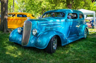 Falcon Heights, MN - June 17, 2022: Low perspective front corner view of a 1936 Chevrolet Street Rod Coupe at a local car show.