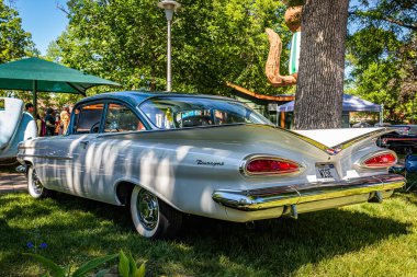 Falcon Heights, MN - June 17, 2022: Low perspective rear corner view of a 1959 Chevrolet Biscayne 2 Door Sedan at a local car show.