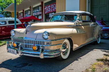 Falcon Heights, MN - June 17, 2022: Low perspective front corner view of a 1947 Chrysler New Yorker Highlander Convertible at a local car show.
