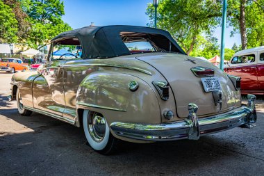 Falcon Heights, MN - June 17, 2022: Low perspective rear corner view of a 1947 Chrysler New Yorker Highlander Convertible at a local car show.