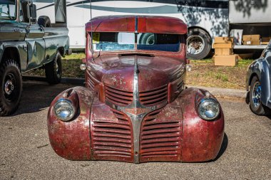 Falcon Heights, MN - June 18, 2022: High perspective front view of a 1941 Dodge WD 15 Rat Rod Pickup Truckat a local car show. clipart
