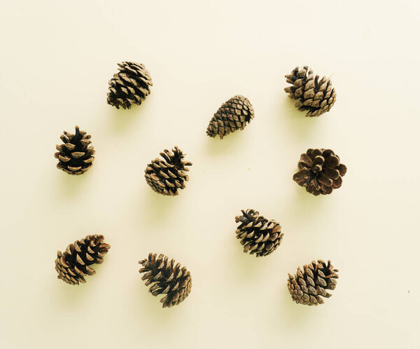 Minimal concept of brown cones on beige background.