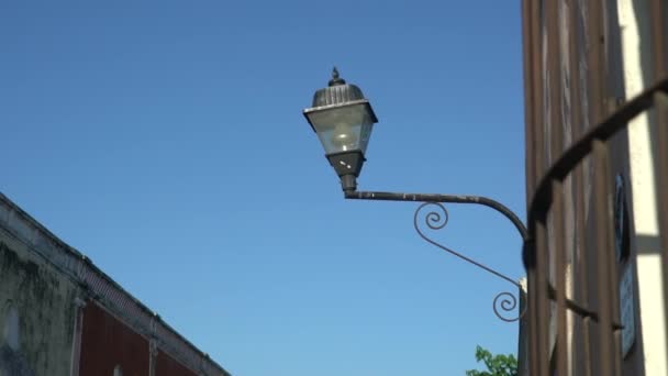 Old Fashioned Street Light On The Red Wall In The Historic Valladolid center — Stock video