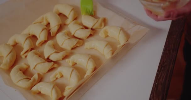 Woman Brushing Croissants with egg — Video Stock