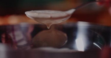 Woman Mixing Yeast in Metal Bowl, Mixing Baking Ingredients.