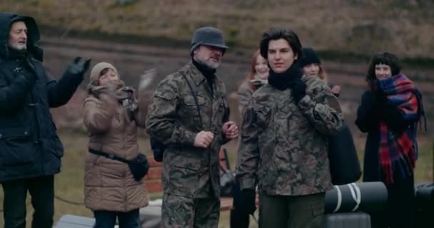 Happy Refugees Applauding Military Soldiers During War. — Vídeos de Stock