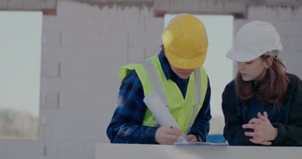 Confident male worker discussing with female contractor — Video