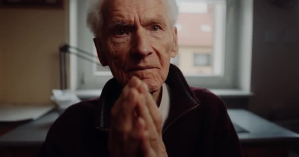 Elderly Senior Man Praying at Home — Stockvideo