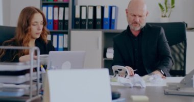 Sad, Overworke, Tensed Businesswoman and Businessman working in office.