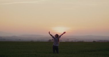 Young Happy Successful Woman at Field Freedom Concept. Positive Successful woman at agricultural field.