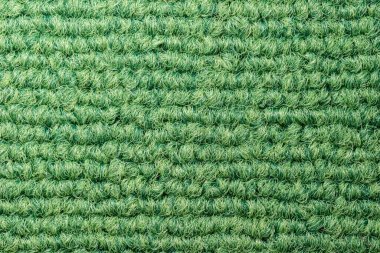 Lüks, pürüzsüz yeşil halı dokusu. Ev, apartman veya ofis için sanat dekoratif konsepti.