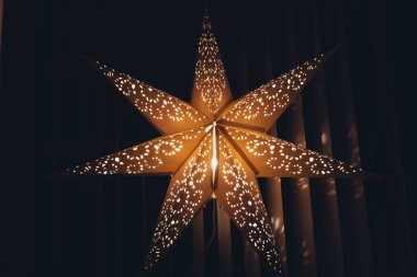an illuminated christmas decoration star