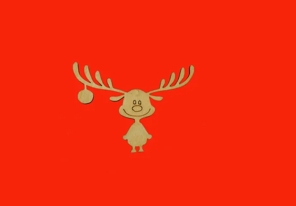 Wooden Christmas toy deer on a red background. positive — Stock Photo, Image