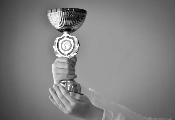 Hands Hold Winner Cup Gray Background Copy Space Black White — Stock Photo, Image