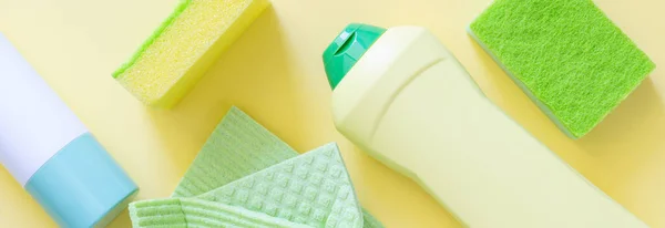 Cleaning Concept Cleaning Supplies Pastel Yellow Background Top View — Stok fotoğraf