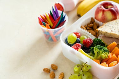 Back to school concept - school lunch with colorful pensils on marble background. High quality photo