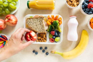 Back to school concept - school lunch with colorful pensils on marble background. High quality photo