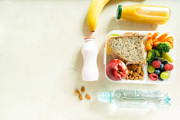 Back to school concept - school lunch with colorful pensils on marble background. High quality photo