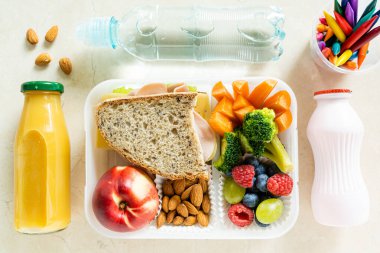 Back to school concept - school lunch with colorful pensils on marble background. High quality photo