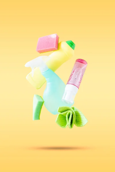 Cleaning Concept Levitation Cleaning Supplies Pastel Yellow Background Copy Space — Stockfoto