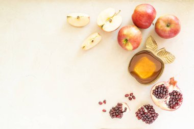 Rosh hashanah concept - honey, pomegranate and apples. High quality photo