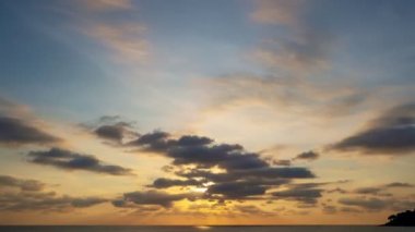 TimeLapse nature motion clouds Beautiful Light sunset sky clouds over sea.Scenery Sky with Amazing dark cloud flowing in sunset sky background.Travel and website background.High quality footage