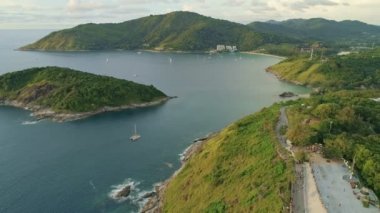 Aerial view of seashore in phuket island.Beautiful sea surface Amazing waves seascape mountain view in Phuket Thailand.High quality footage from drone 4K