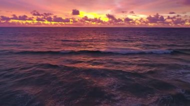 Aerial view Beautiful view sunset or sunrise over sea surface beautiful wave Amazing light twilight sky sunset. Cinematic drone shot dynamic footage beautiful light of nature seascape