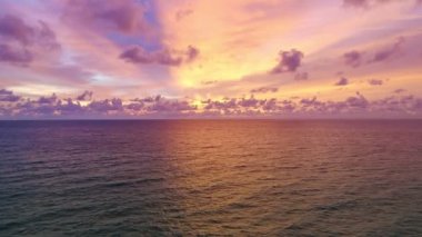 Aerial view Beautiful view sunset or sunrise over sea surface beautiful wave Amazing light twilight sky sunset. Cinematic drone shot dynamic footage beautiful light of nature seascape