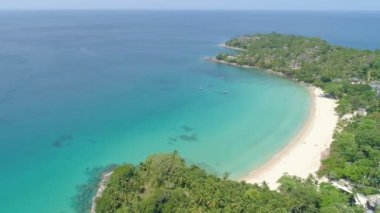 Aerial view of seashore in phuket island.Beautiful sea surface Amazing waves seascape mountain view in Phuket Thailand.High quality footage from drone 4K