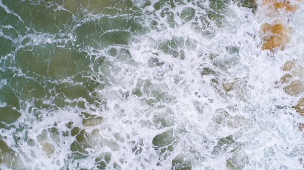 Top View of the Sea texture waves Foaming and Splashing in the Ocean Sunny day beautiful sea surface background