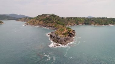 Aerial view of seashore in phuket island.Beautiful sea surface Amazing waves seascape mountain view in Phuket Thailand.High quality footage from drone 4K