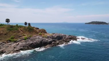 Aerial view of seashore in phuket island.Beautiful sea surface Amazing waves seascape mountain view in Phuket Thailand.High quality footage from drone 4K