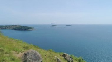 Aerial view of seashore in phuket island.Beautiful sea surface Amazing waves seascape mountain view in Phuket Thailand.High quality footage from drone 4K