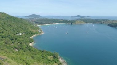 Aerial view of seashore in phuket island.Beautiful sea surface Amazing waves seascape mountain view in Phuket Thailand.High quality footage from drone 4K