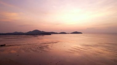 Sea at sunset or sunrise over beach video 4K, The sun touches horizon, Red sky in golden hour amazing seascape,Ocean beach sunsets Aerial view seascape