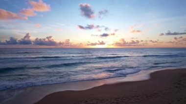 Sea at sunset or sunrise over beach video 4K, The sun touches horizon, Red sky in golden hour amazing seascape,Ocean beach sunsets Aerial view seascape
