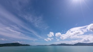 Aerial view Timelapse Hyperlapse amazing seascape at green mountain Phuket island aerial view.Ocean bay with greenery hilly scenery. Amazing summer vacation at cruise boats around Phuket archipelago