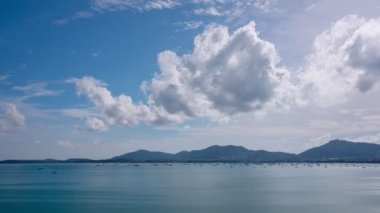 Aerial view Timelapse Hyperlapse amazing seascape at green mountain Phuket island aerial view.Ocean bay with greenery hilly scenery. Amazing summer vacation at cruise boats around Phuket archipelago