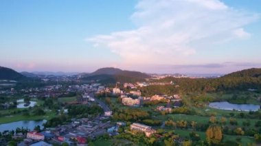 Aerial Drone view Sunset or sunrise mountain and road in kathu city Phuket thailand, Beautiful sunset sky, transportation footage background 4K Time lapse Transportation concept